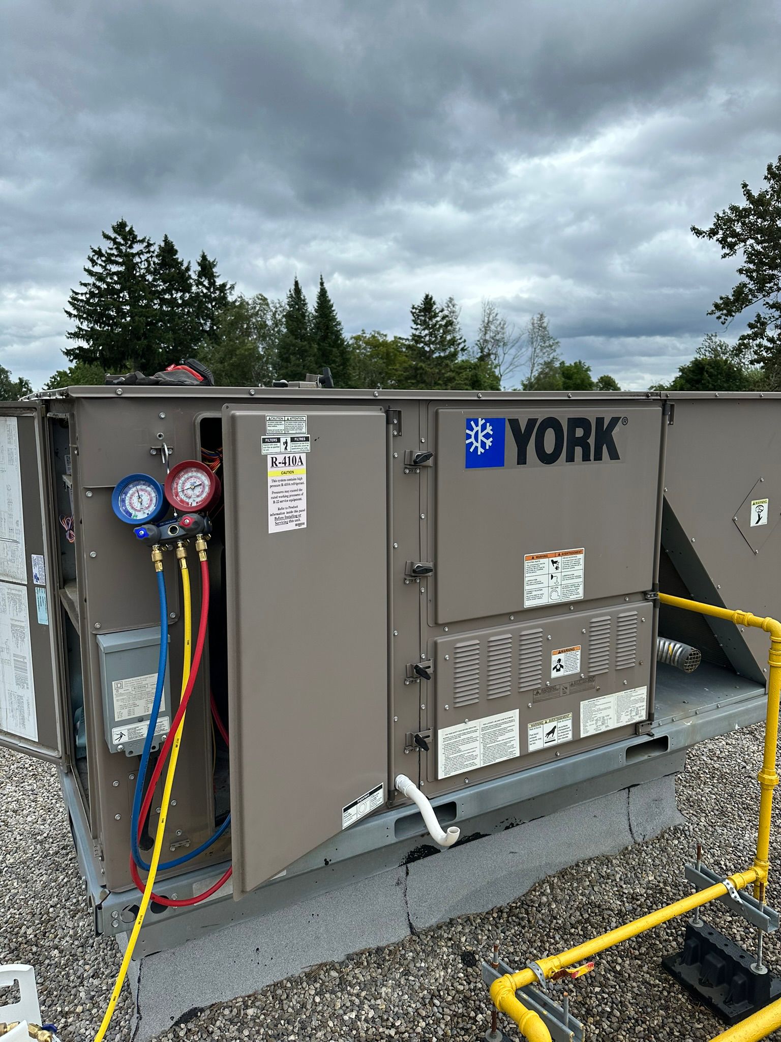 York rooftop unit with refrigerant gauges connected during service at a Markham commercial property