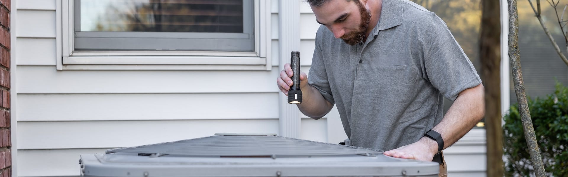 HVAC technician inspecting equipment